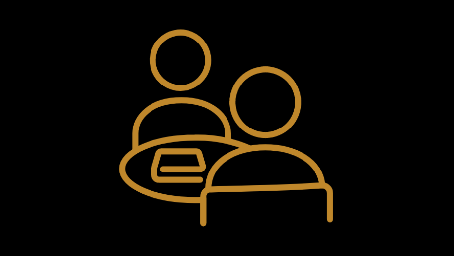 a gold on black icon of two people sitting across a table from one another